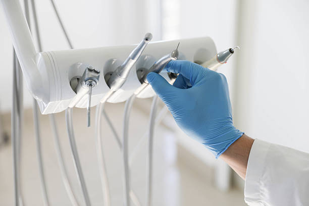 Professional Invisalign Clear Aligners technician working in White Cloud, MI